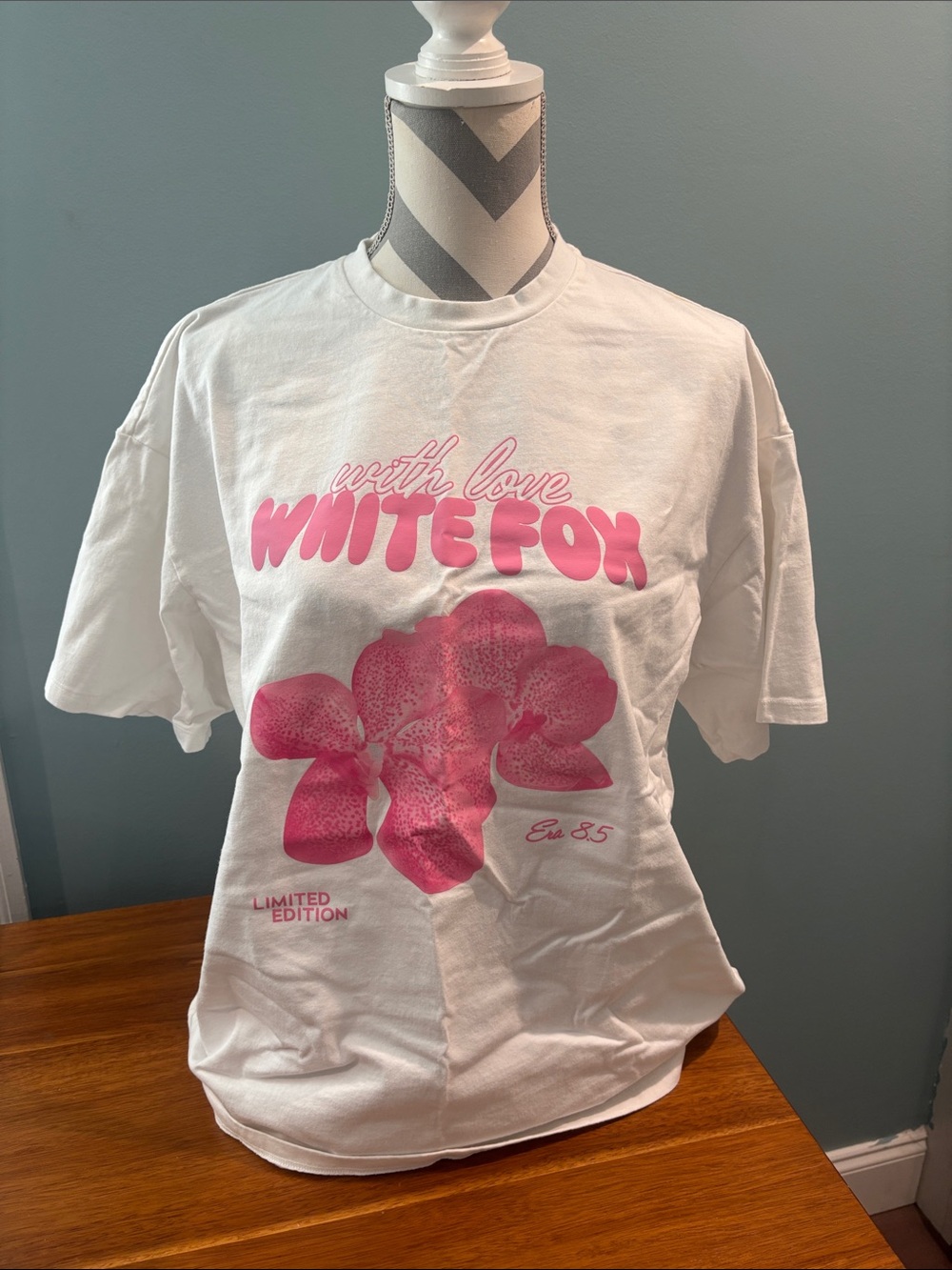 White Fox Boutique White Short Sleeve Tee with Pink Floral Logo